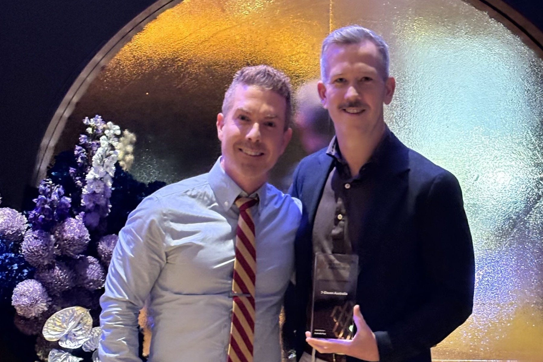 Cameron Lawson and Paul Wallace from 7-Eleven Australia with the ARA Innovation Excellence trophy.